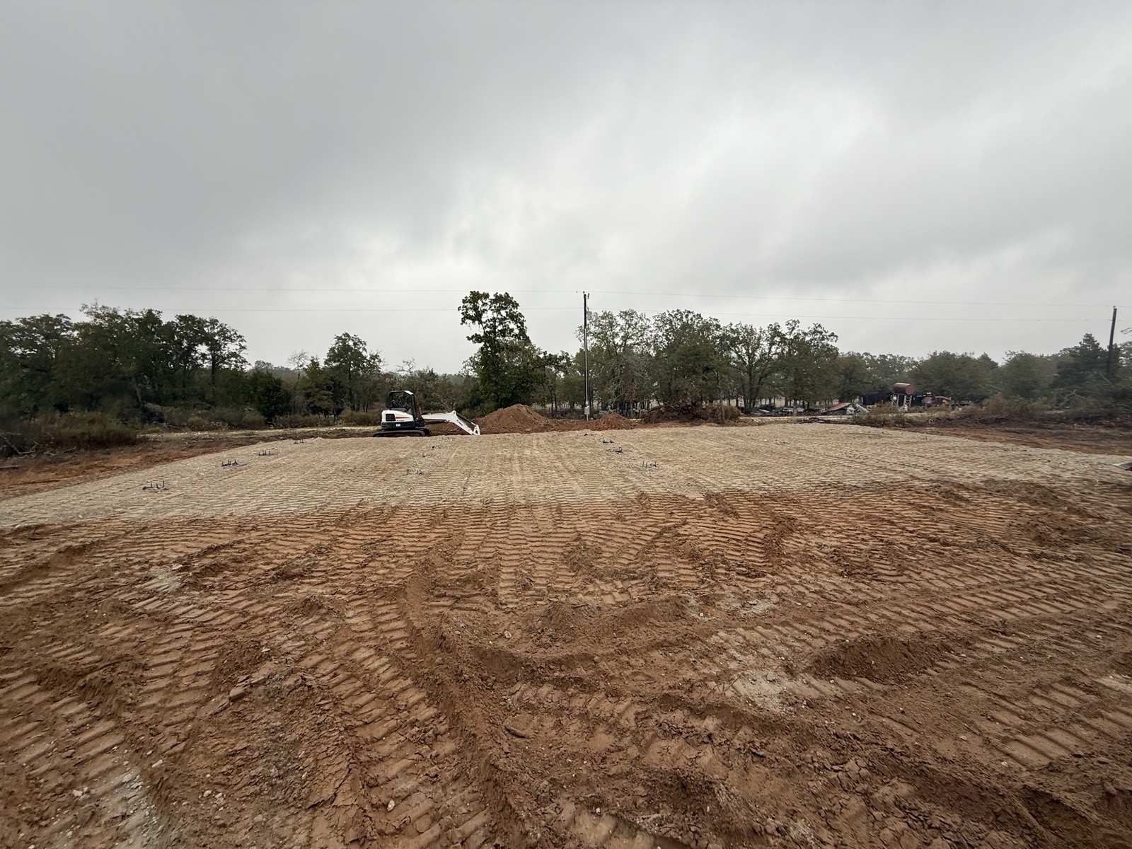 Pad cut, graded, and compacted where the brush stood