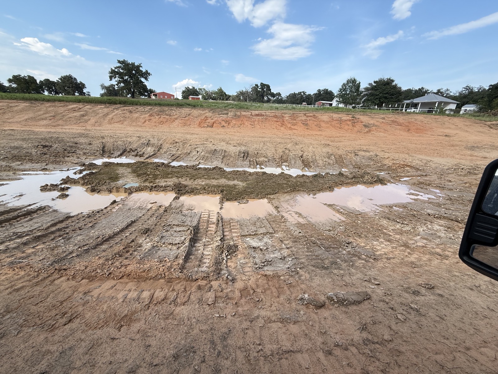 Pond basin mid-grade, wet clay tracked up
